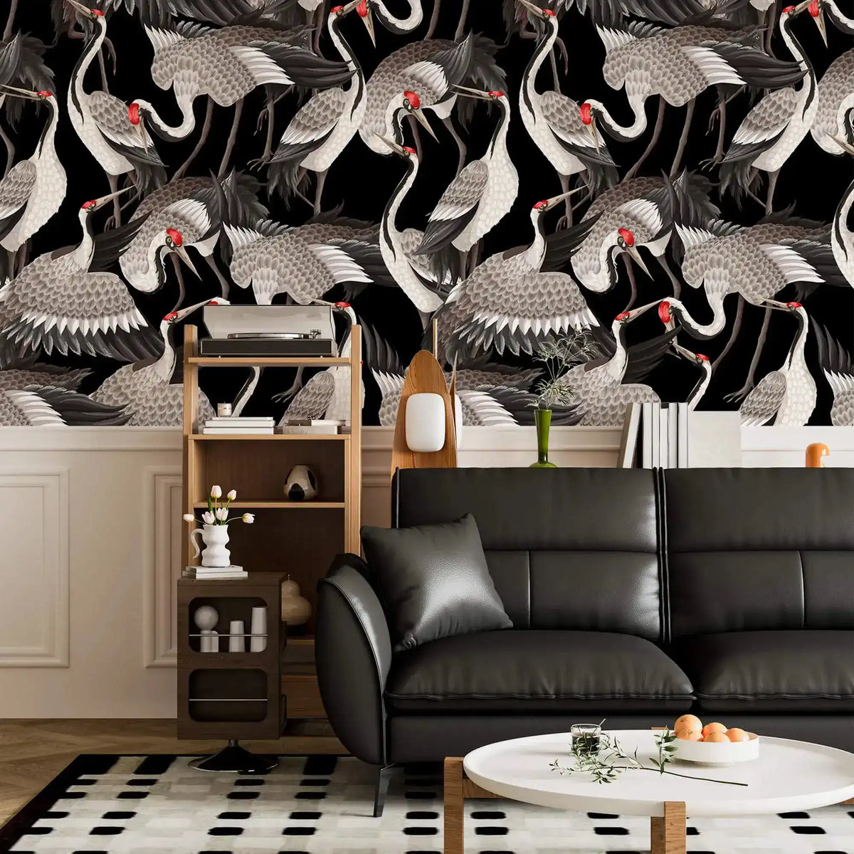 Graceful Crane Haven Wallpaper of flocking cranes above a black leather sofa and wood shelf