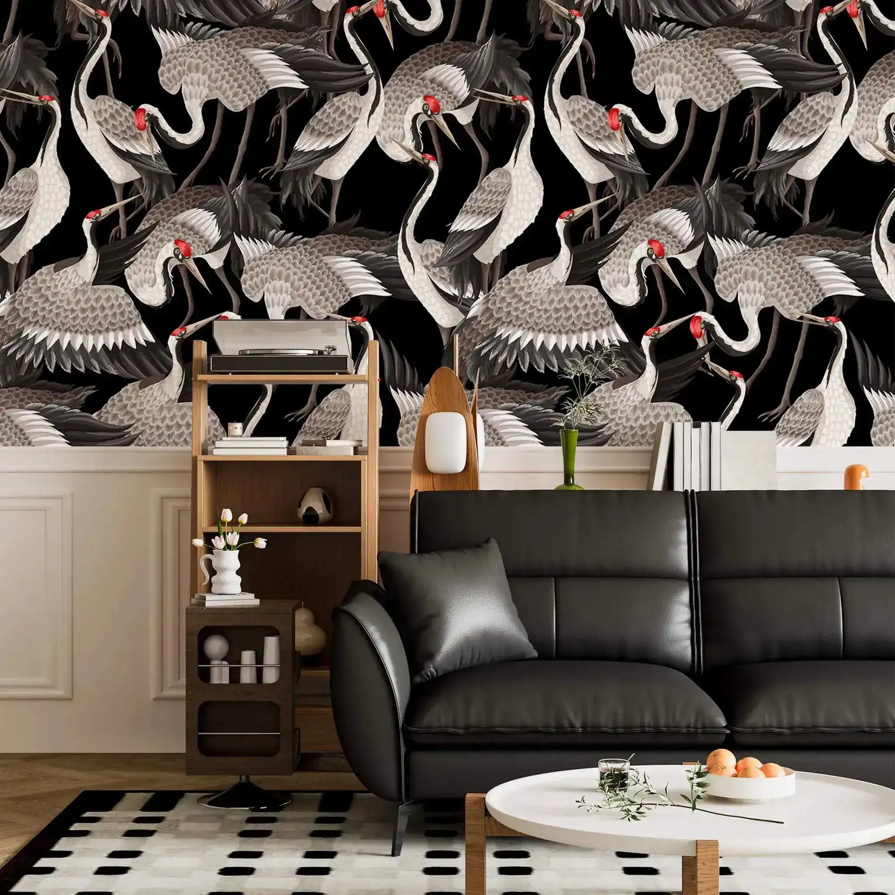 Graceful Crane Haven Wallpaper of flocking cranes above a black leather sofa and wood shelf