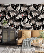 Graceful Crane Haven Wallpaper of red-crowned cranes above a caramel sofa and rattan cabinet