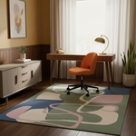 Home office with a desk, chair, and abstract rug