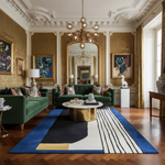 Luxurious living room with green sofas, a gold coffee table, an abstract wool rug, and decorative elements.