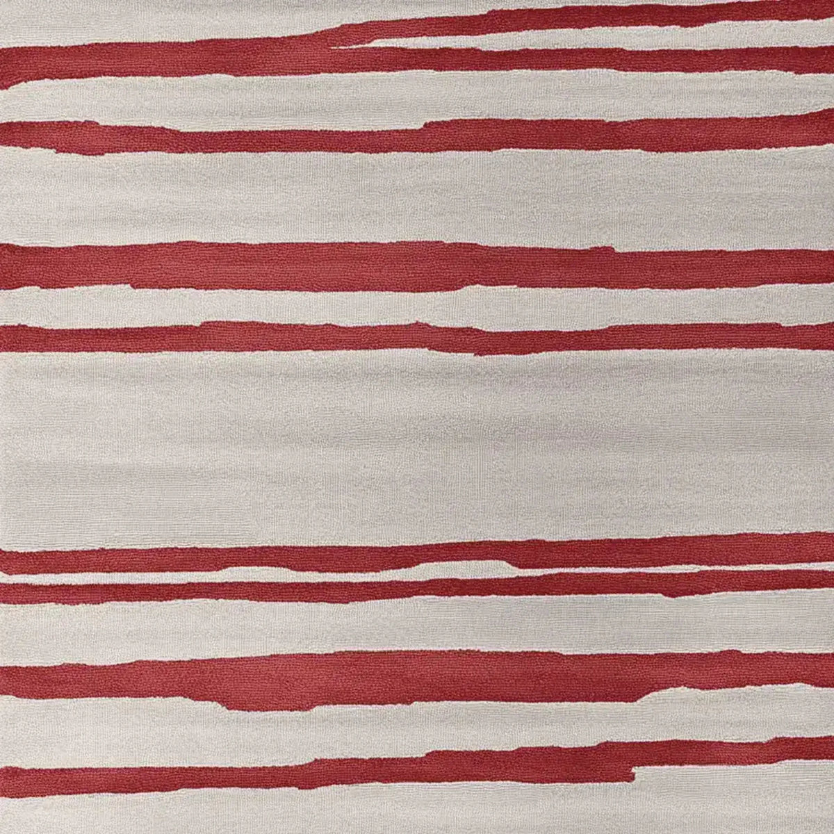A contemporary area rug featuring bold red and cream stripes, perfect for a stylish living room. This hand-tufted wool rug adds a modern touch to large living room spaces, making it an ideal choice for those seeking high-quality rugs for living room decor.