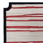 This contemporary area rug showcases a bold graphic stripes design in red and cream, perfect for adding a stylish touch to large living rooms. Made from high-quality wool, this hand-tufted rug offers a modern aesthetic ideal for any living space.