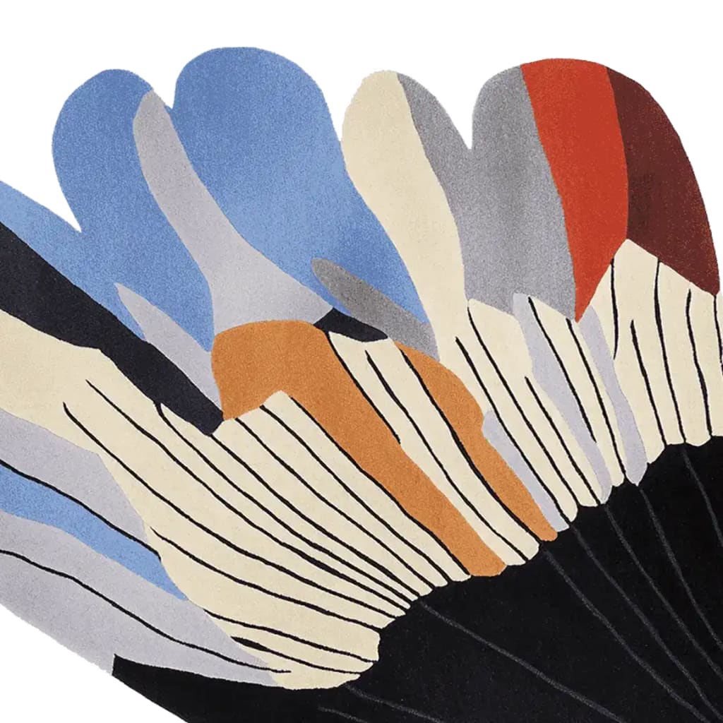 This area rug showcases a vibrant, contemporary design with abstract shapes in hues of blue, orange, red, and white. Perfect for large living rooms, this wool rug adds a modern touch to any space, combining style and comfort.