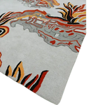 Vibrant contemporary area rug with abstract patterns in orange, red, and black on a light grey background. Perfect for adding a touch of vintage charm to a bedroom or living room setting, this wool rug offers a stylish and colorful accent to any space.