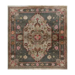 Elegant hand-knotted area rug featuring a vintage Persian design with intricate floral patterns in muted tones. Perfect for adding a touch of sophistication to large living rooms, this stunning gray medallion rug exudes timeless elegance.