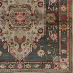 This elegant Gray Medallion Area Rug showcases a vintage Persian style with intricate floral patterns. Ideal for large living rooms, the hand-knotted design adds a touch of sophistication.