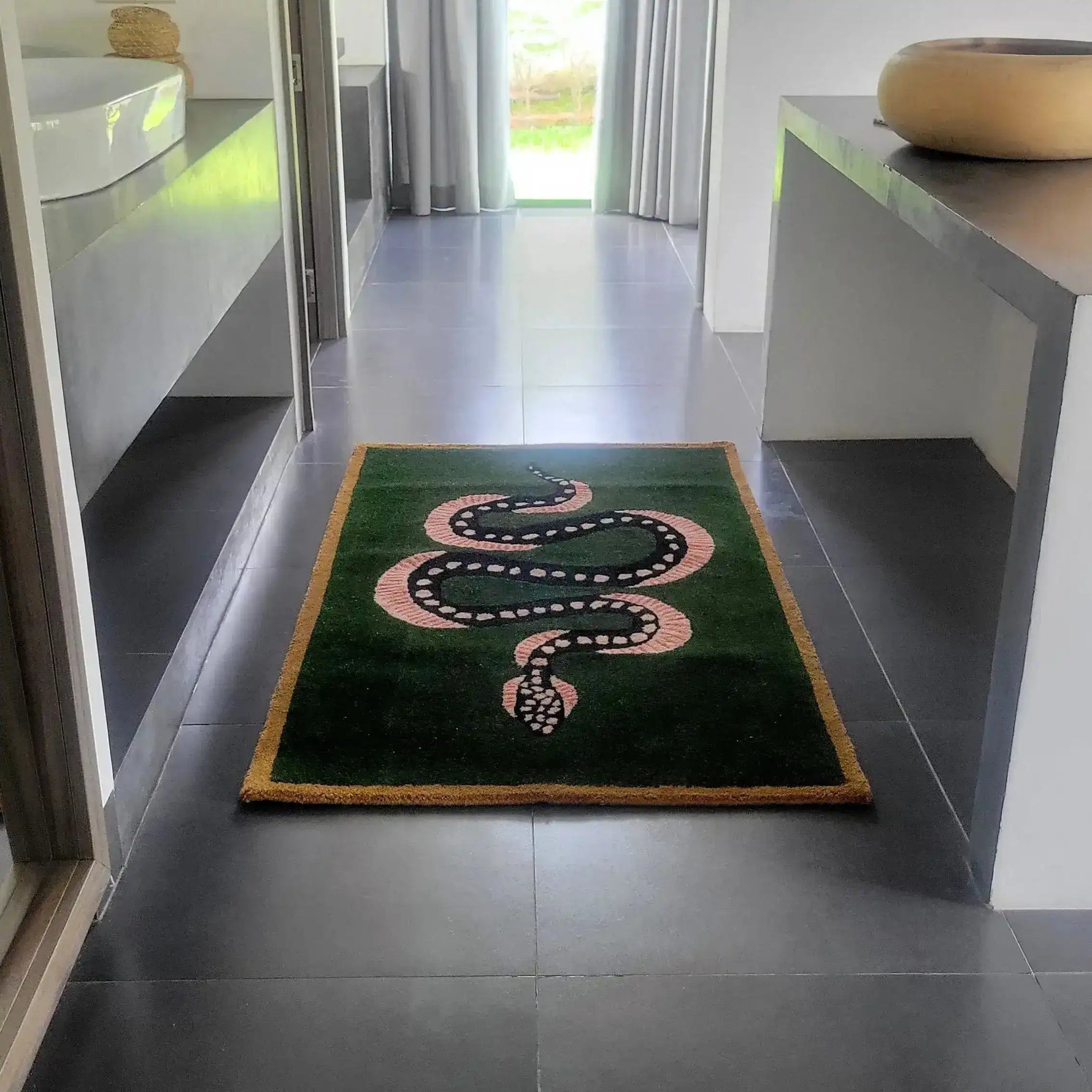 Elegant Green and Black Snake Hand Tufted Wool Area Rug placed in a modern hallway. This vintage rug features a striking snake design, perfect as a dining room or living room rug. Ideal for adding a touch of sophistication to your space, this wool rug offers both style and comfort.