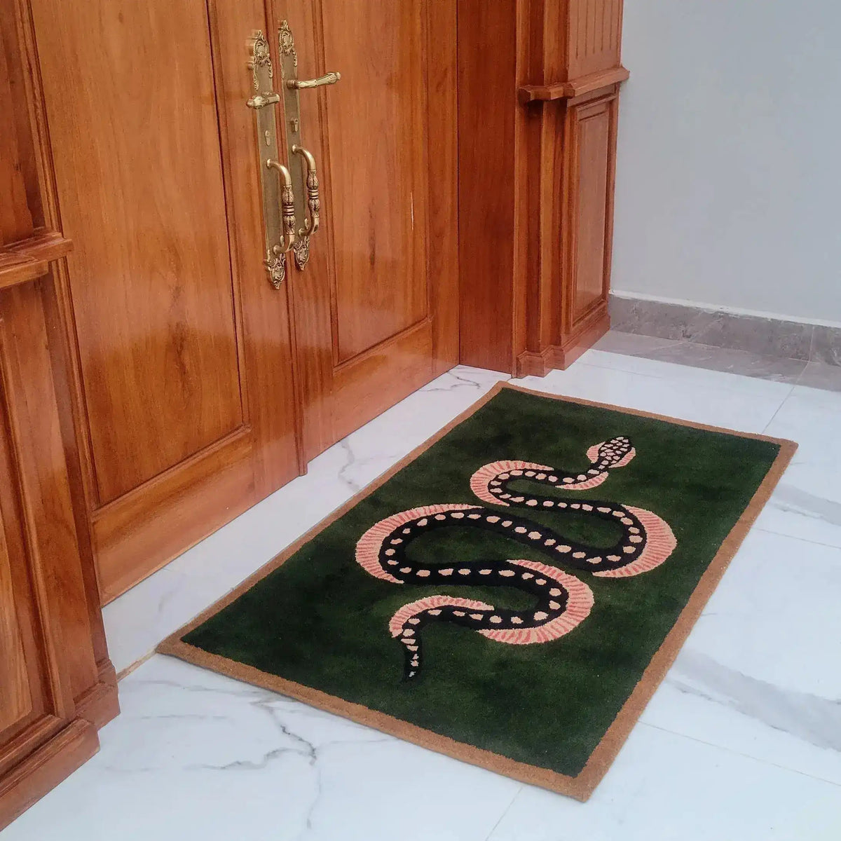 The Green and Black Snake Hand Tufted Wool Area Rug is showcased in a sophisticated setting, perfect for enhancing your dining room or living room. This vintage rug features a striking snake design on a lush green backdrop, offering a touch of elegance and intrigue. Ideal for use as a dining table rug or as one of your living room rugs in an 8x10 size, this wool rug combines artistic flair with functional style.