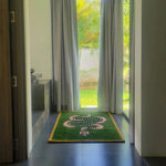 A stylish hand-tufted wool area rug featuring a green and black snake design. Perfect for adding a vintage touch to dining rooms or as a striking living room rug in an 8x10 size. Ideal for placing under a dining table, this wool rug enhances any interior with its bold pattern and luxurious texture.