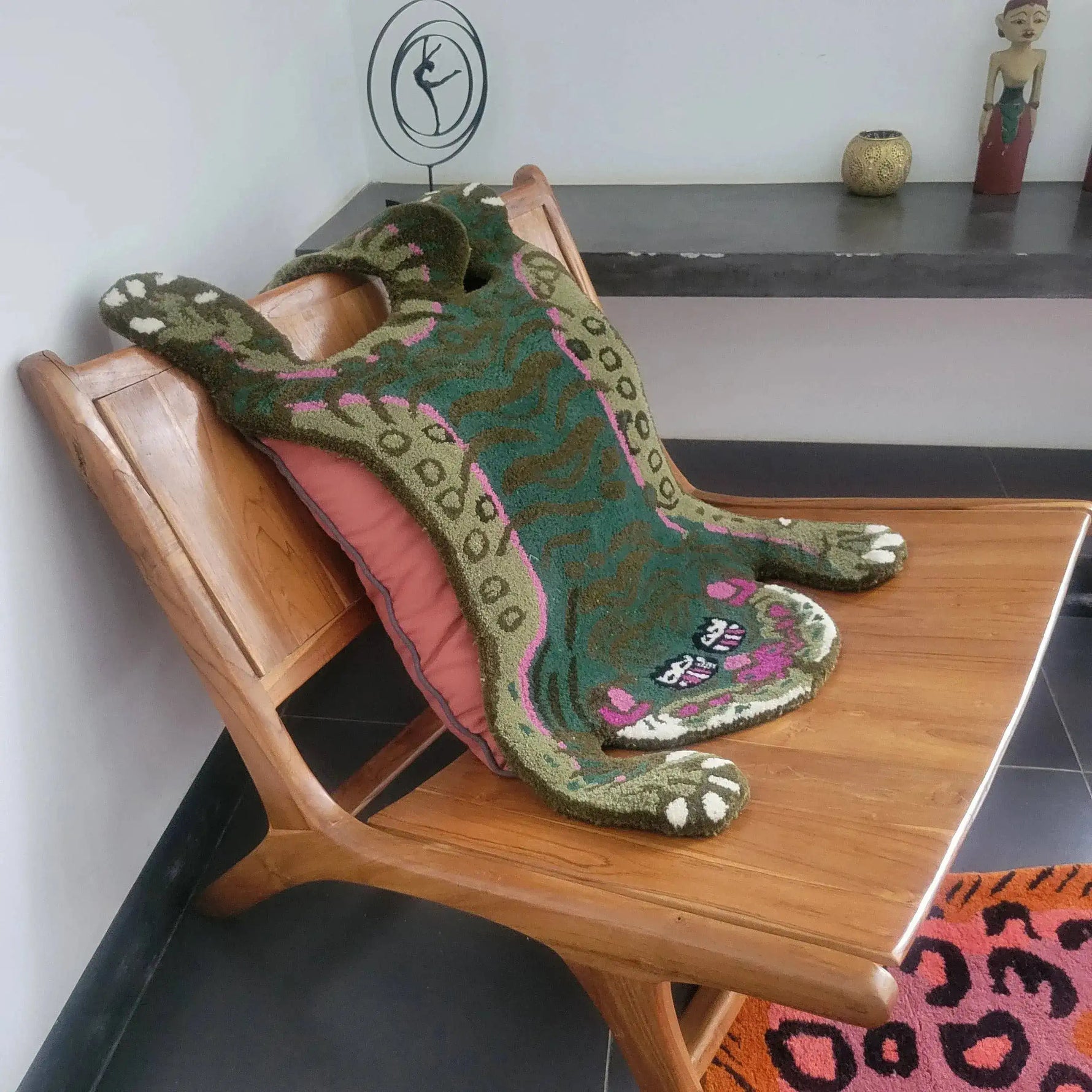 This charming Green Asian Tiger Wool Rug, reminiscent of a vintage rug style, adds a touch of whimsy to any room. Perfect as an area rug for dining rooms or offices, this wool rug features an abstract tiger design in green and pink tones. Ideal for formal dining room settings, it brings a unique flair to your dining room carpets collection.