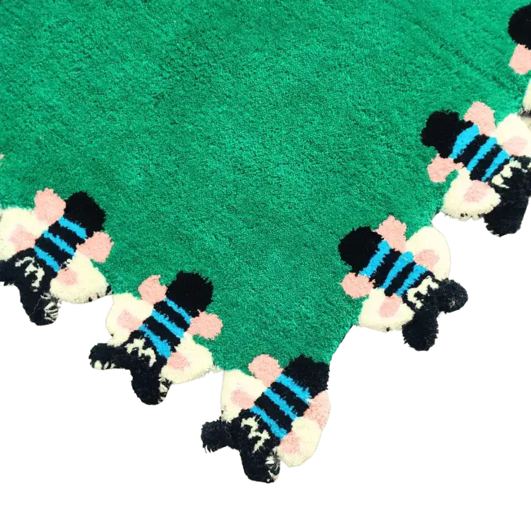 A vibrant hand-tufted wool area rug featuring a bright green base with playful bee motifs along the edge, perfect for adding a whimsical touch to living rooms or bedrooms. Ideal as a unique bedroom area rug or a statement piece in the living room.