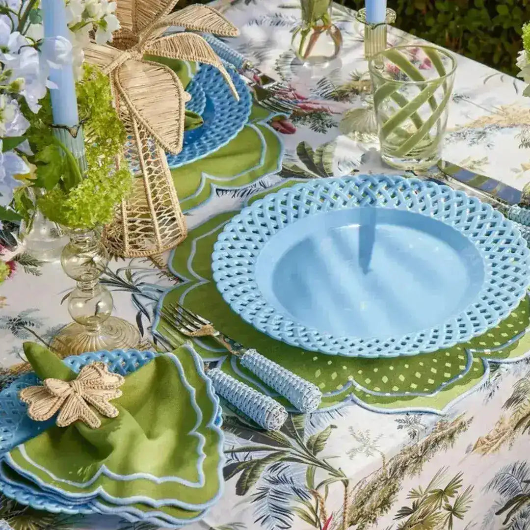 green essence placemat outdoor table with blue lattice plate green napkin wicker dragonfly ring and wicker palm centerpiece