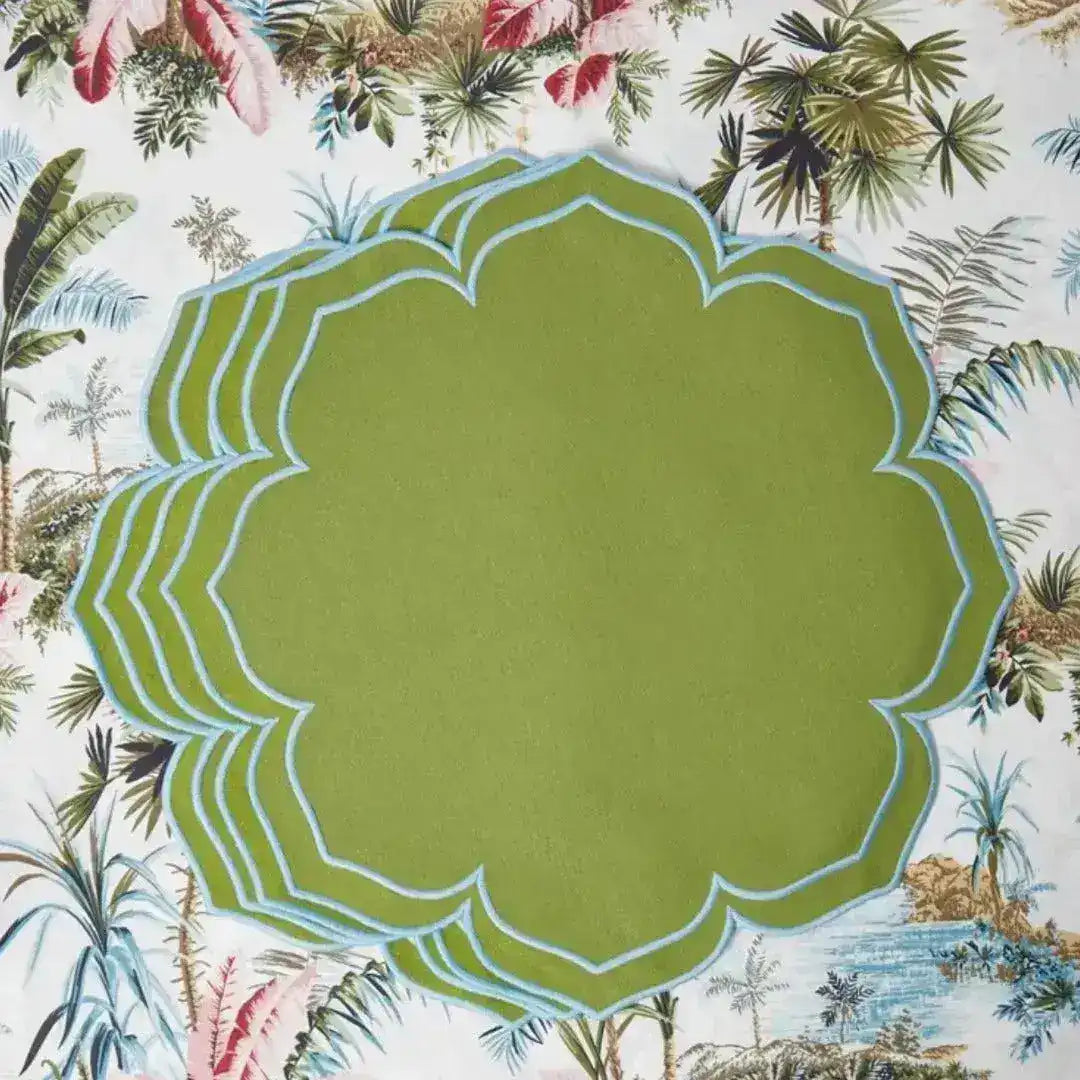 green essence placemats stacked olive green with blue scalloped edge on tropical palm botanical tablecloth