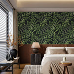 Green fern foliage wallpaper on dark ground above wood paneling in a calm neutral bedroom