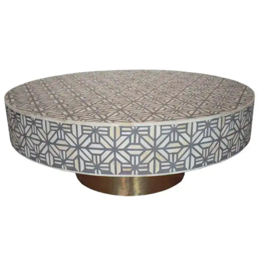 Grey spider bone inlay coffee table, round low form with grey and cream geometric star lattice, brass pedestal base