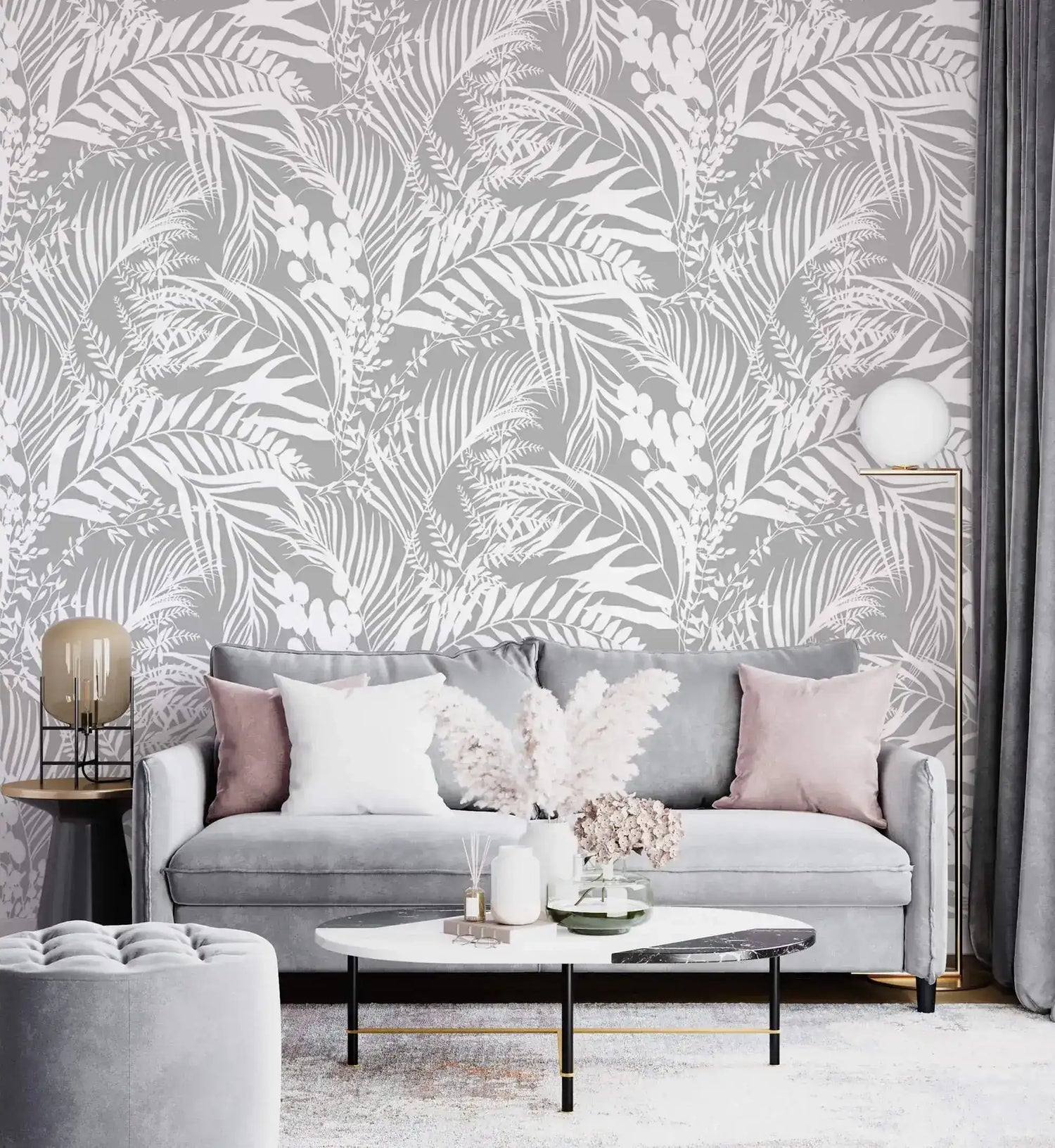 Grey Tropical Foliage Wallpaper of white ferns on grey behind a grey sofa with pink cushions