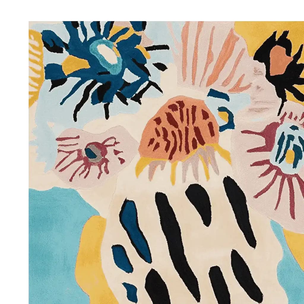 Close-up view of a vibrant Groovy Garden Forms Hand Tufted Area Rug, showcasing abstract floral patterns in blue, yellow, and pink. This contemporary wool rug is perfect for adding a splash of color to any living room. Ideal as an 8x10 area rug for modern interiors.