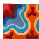 A vibrant, abstract Groovy Heat Map Hand Tufted area rug showcasing bold, swirling patterns in shades of red, blue, orange, and cream. This contemporary wool rug is perfect for adding a splash of color to any living room, offering both style and comfort.