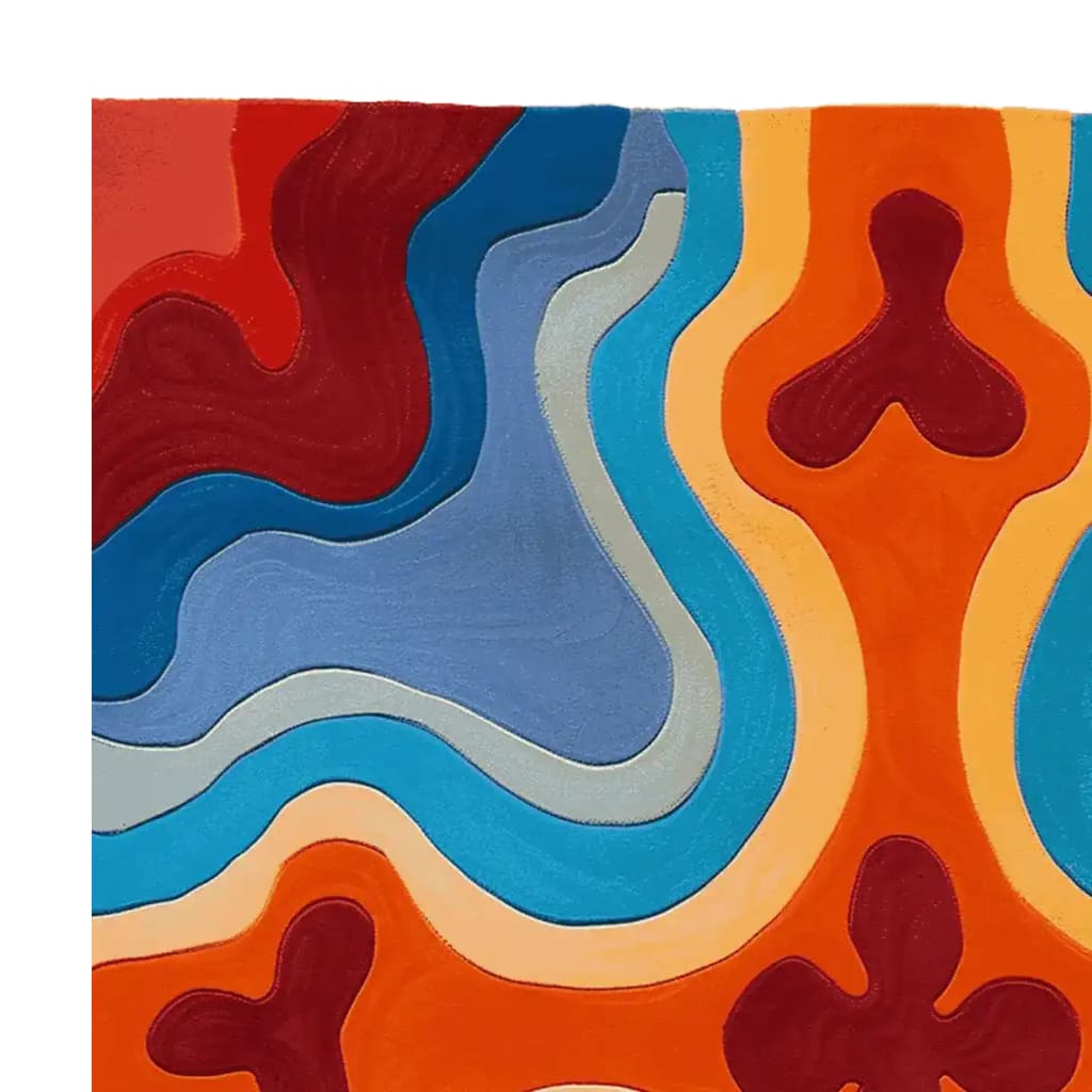 A vibrant, abstract Groovy Heat Map Hand Tufted area rug showcasing bold, swirling patterns in shades of red, blue, orange, and cream. This contemporary wool rug is perfect for adding a splash of color to any living room, offering both style and comfort.