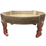 Round carved wooden chakki table, angled view showing carved band and legs