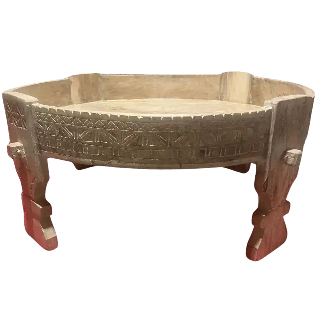 Round carved wooden chakki table, angled view showing carved band and legs