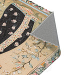 Hand-Painted Floral Rug - Close-up corner fold showing printed textile surface in black and cream botanical pattern with grey non-slip backing