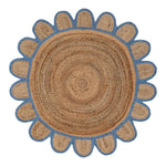 A handmade blue scalloped round jute rug, featuring a natural woven texture with a charming blue scalloped edge. Perfect for adding a touch of rustic elegance to a dining room or as a standout piece in large living room areas. This area rug, with its earthy tones and unique design, complements various styles, making it ideal for any living room setting.