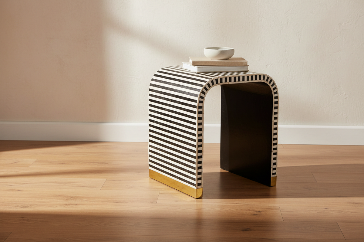 Handmade bone inlay waterfall side end table with an arched striped frame and brass footing.