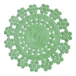 Beautiful Handmade Desi Round Jute Rug in Green, perfect for enhancing large living room spaces. This intricately designed area rug features a floral pattern that adds a touch of elegance to your living room area. Its round shape makes it a versatile choice for any decor style.