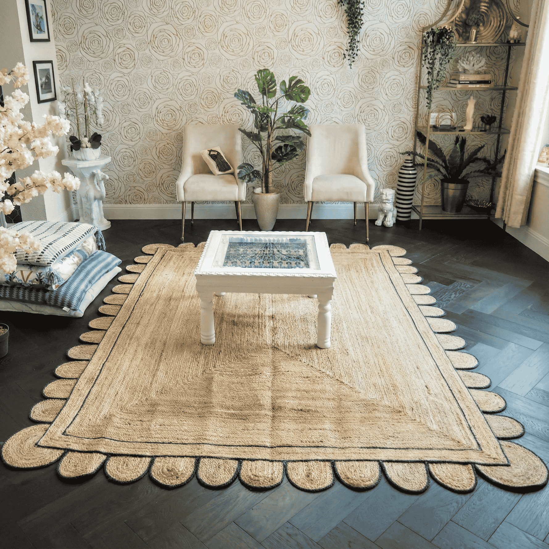 Living room with a beige jute rug, white chairs, and a coffee table.