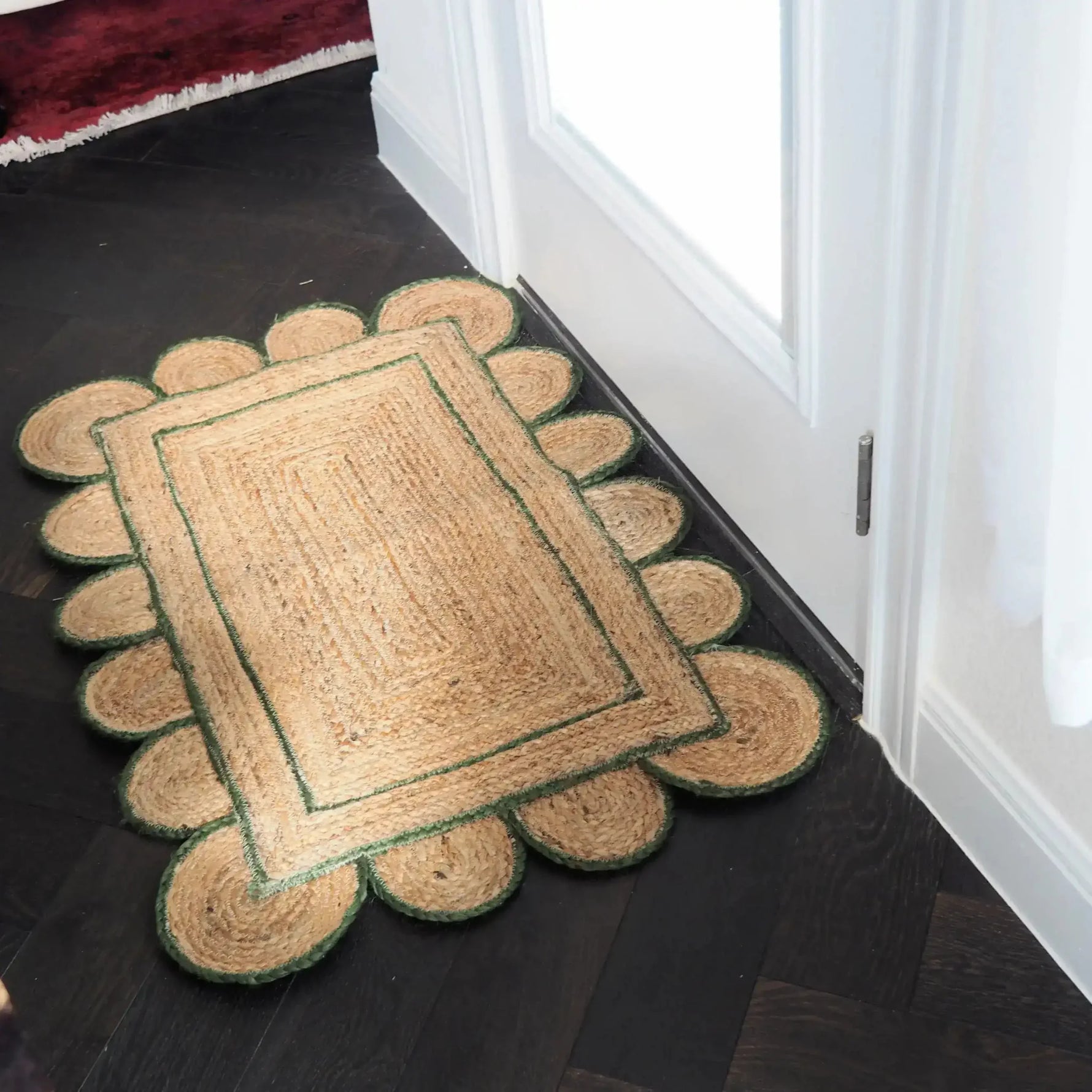Handmade Olive Green Scalloped Border Jute Rug in a cozy corner, perfect as a stylish area rug for living rooms, kitchens, or hallways. This 4 x 6 ft rug features a natural jute texture with a charming scalloped design, ideal for adding warmth and elegance to any space.