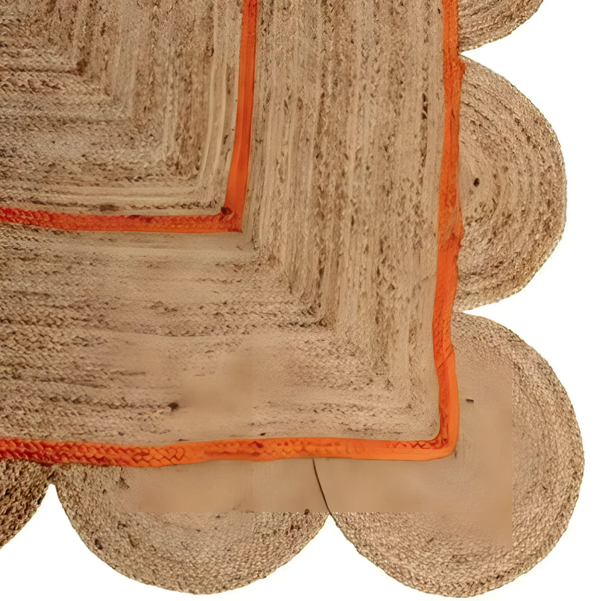 Close-up view of a handmade orange scalloped jute rug, perfect as an area rug for a dining room or living room. The intricate design and natural texture make it an ideal dining table rug, adding warmth and style to your space.