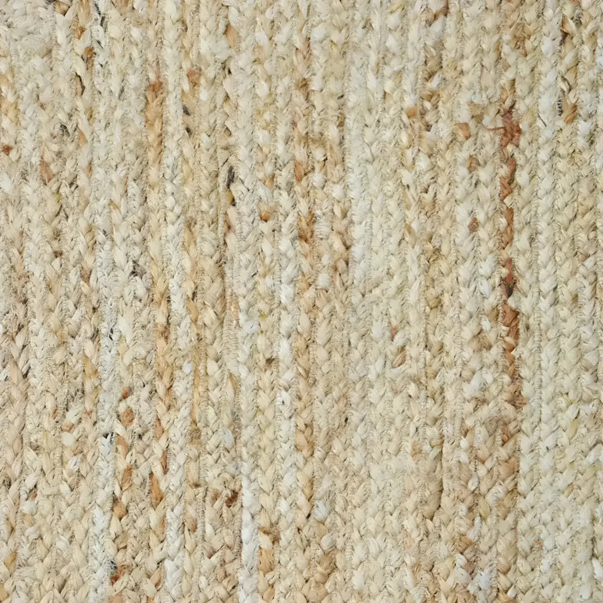 Close-up view of a handmade orange scalloped jute area rug, showcasing its intricate woven texture. Ideal for enhancing dining rooms and living rooms, this rug adds warmth and style under a dining table or as a centerpiece in a living space.