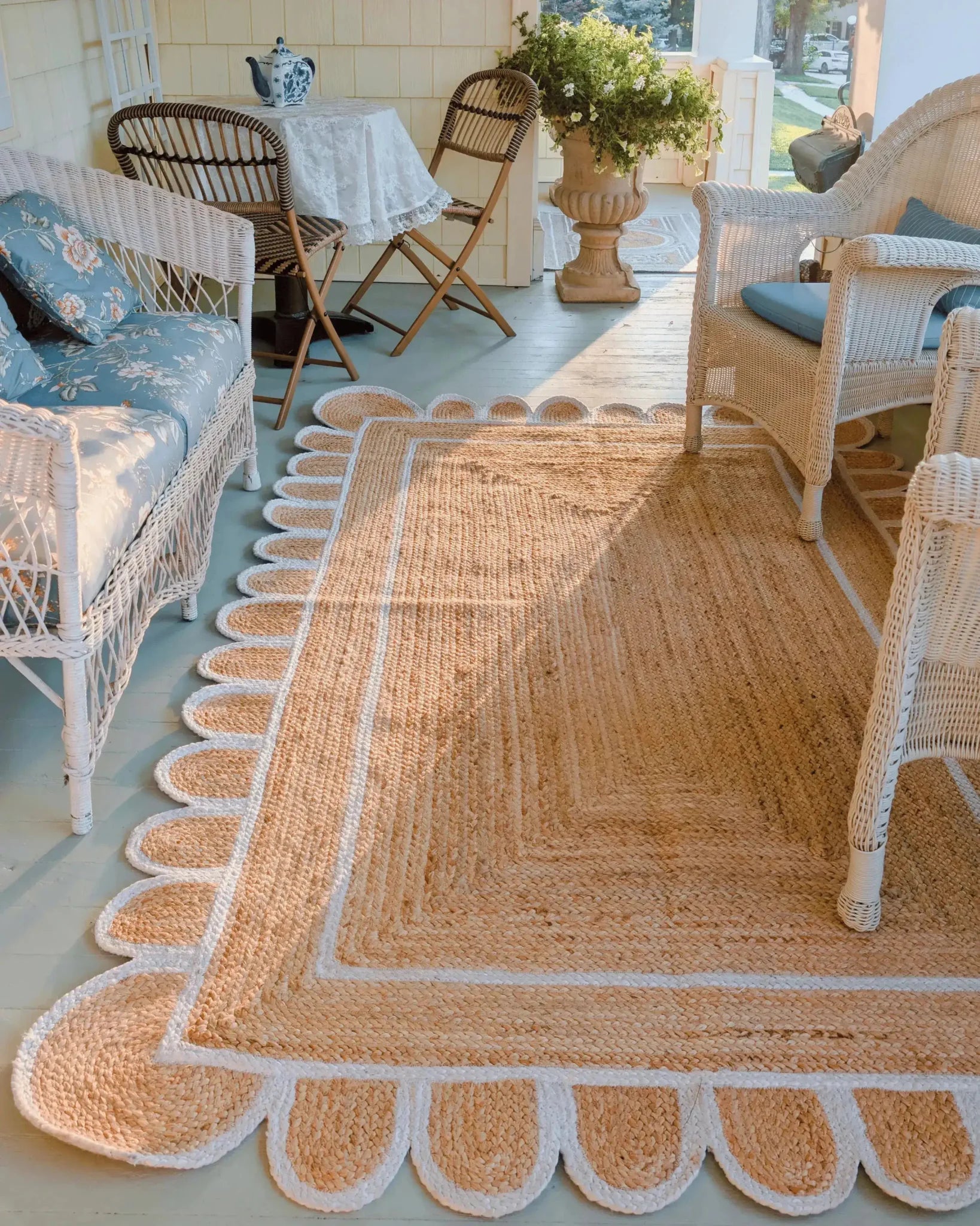 Charming Handmade White Trim Scalloped Jute Rug in a cozy living room setting, perfect as an area rug for adding warmth and elegance. Ideal for those seeking living room area rugs with a natural jute texture.