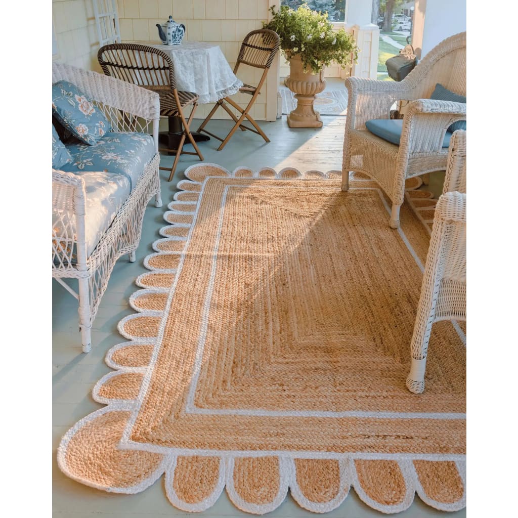 Charming Handmade White Trim Scalloped Jute Rug in a cozy living room setting, perfect as an area rug for adding warmth and elegance. Ideal for those seeking living room area rugs with a natural jute texture.