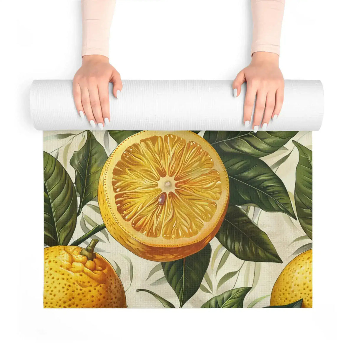 Hands unrolling a yoga mat to reveal a large sliced-lemon and foliage print in vivid yellow and green