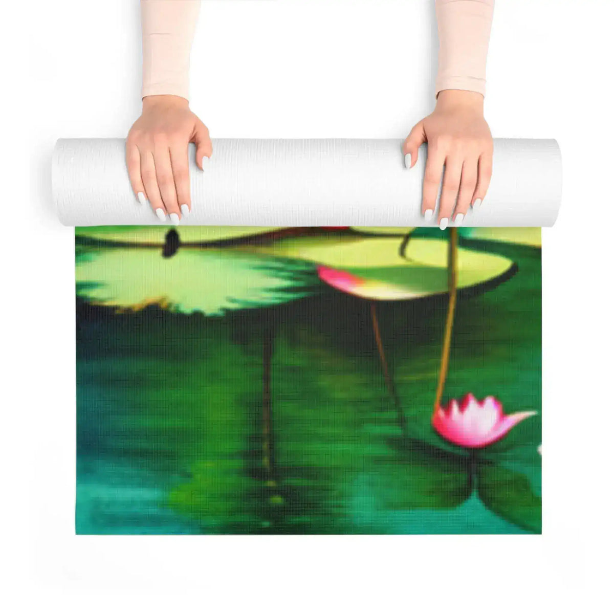 Hands unrolling foam yoga mat revealing pink lotus and green lily pond print