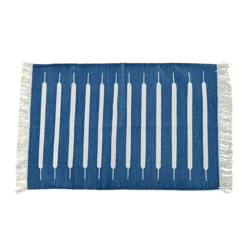 A handwoven blue and white mini stripe cotton area rug featuring fringes on the edges, perfect for adding a touch of boho charm to your dining room or living room. Ideal size for a dining table rug or living room rugs 8x10.
