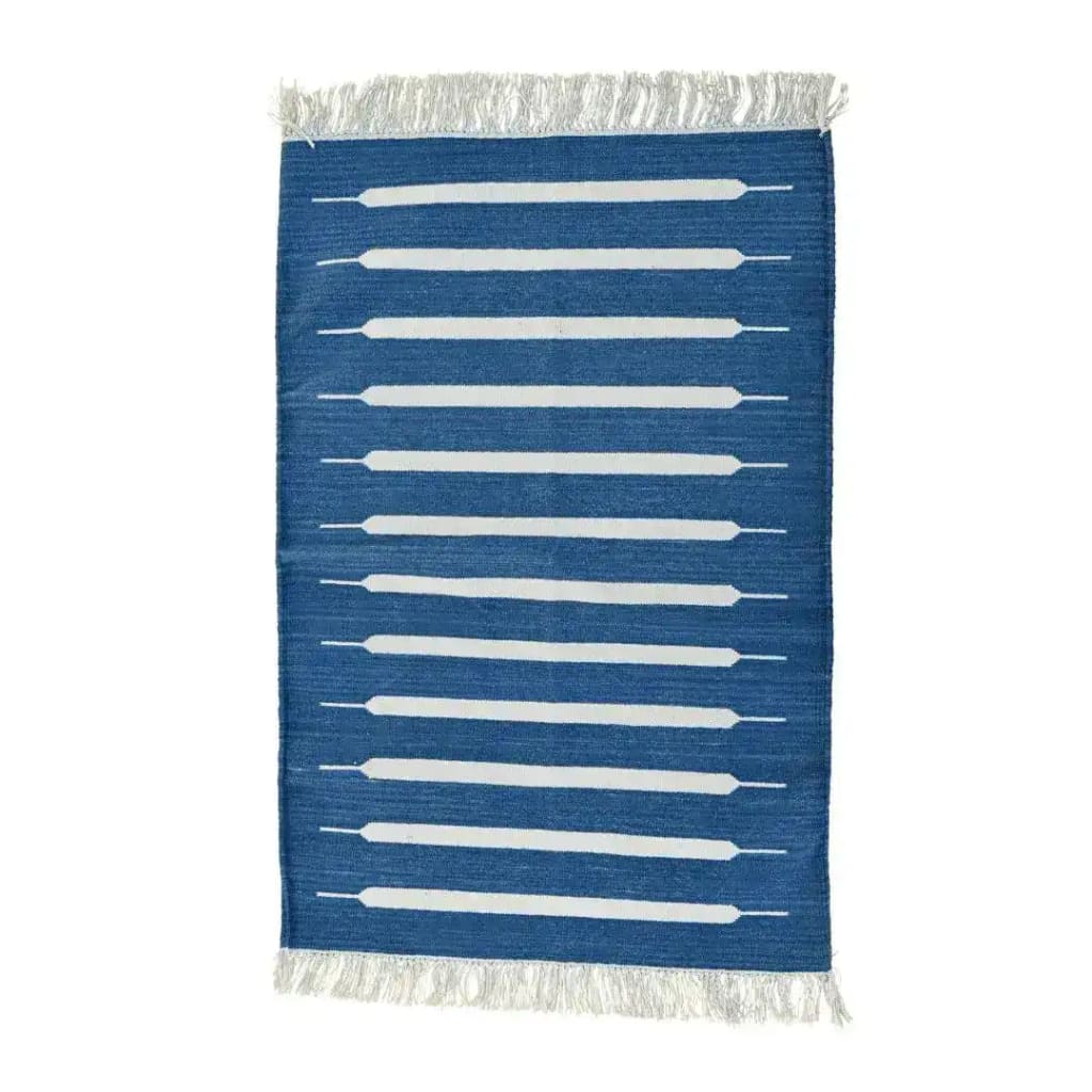 Handwoven blue and white mini stripe cotton area rug with fringes, ideal for dining room and living room settings. This boho rug showcases a modern design, perfect as a dining table rug or living room rug in an 8x10 size.