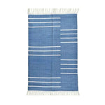 Handwoven blue and white minimalist cotton rug with fringes, ideal for a boho-inspired living room. This area rug features sleek white lines on a blue background, perfect for adding a modern touch to your space. Suitable for living room rugs 8x10, this cotton rug is both stylish and functional.