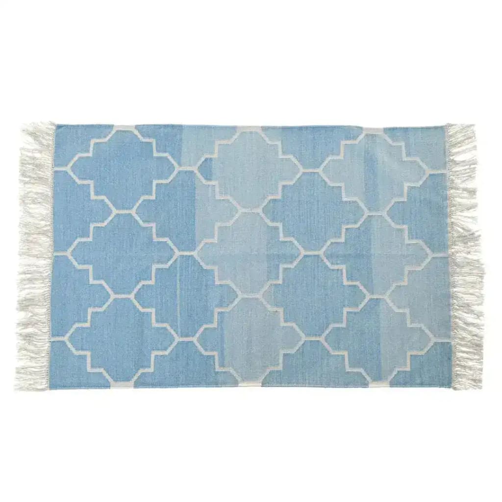 A beautiful handwoven area rug with a blue and white Moroccan pattern, perfect for adding a touch of boho style to your living room. The cotton rug features intricate geometric designs and fringes on the edges, ideal for use as an 8x10 living room rug.