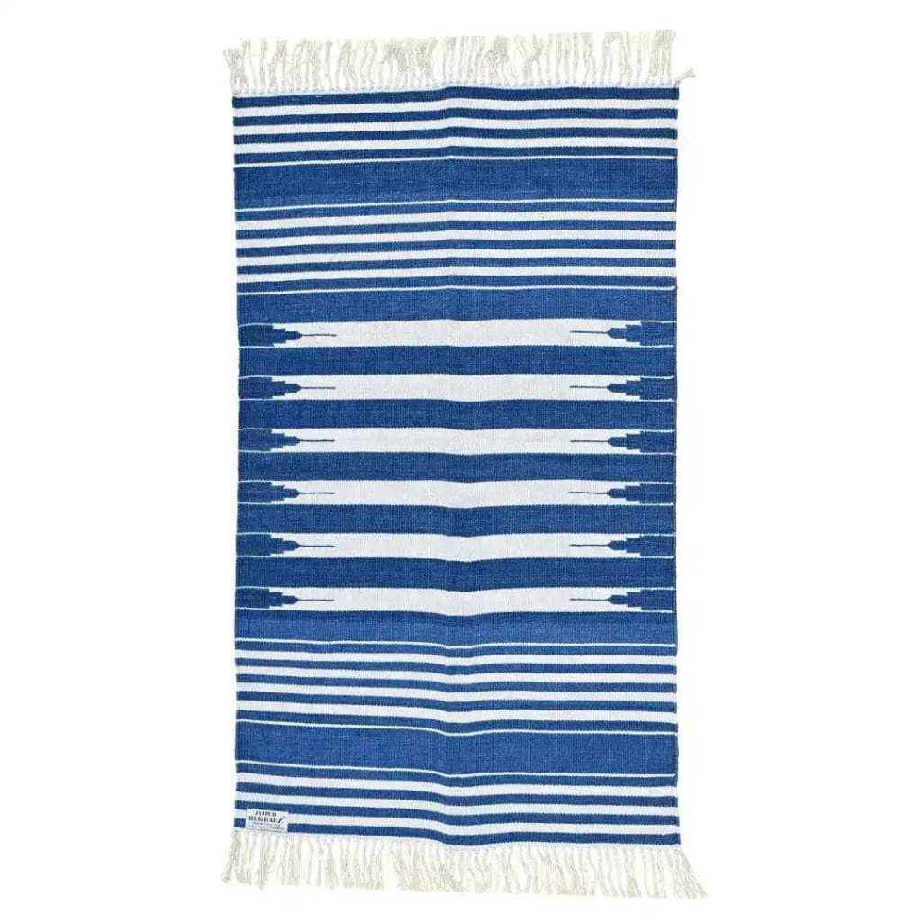 Handwoven blue and white stripe cotton area rug with fringes, perfect for adding a boho touch to dining rooms and bedrooms. This dining table rug features a classic stripe pattern, ideal for those seeking stylish cotton rugs for their home decor.
