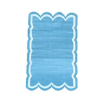Handwoven blue and white scallop cotton area rug, perfect for dining rooms and living spaces. This boho rug adds a touch of elegance, making it an ideal dining table rug or a stylish addition to any living room.