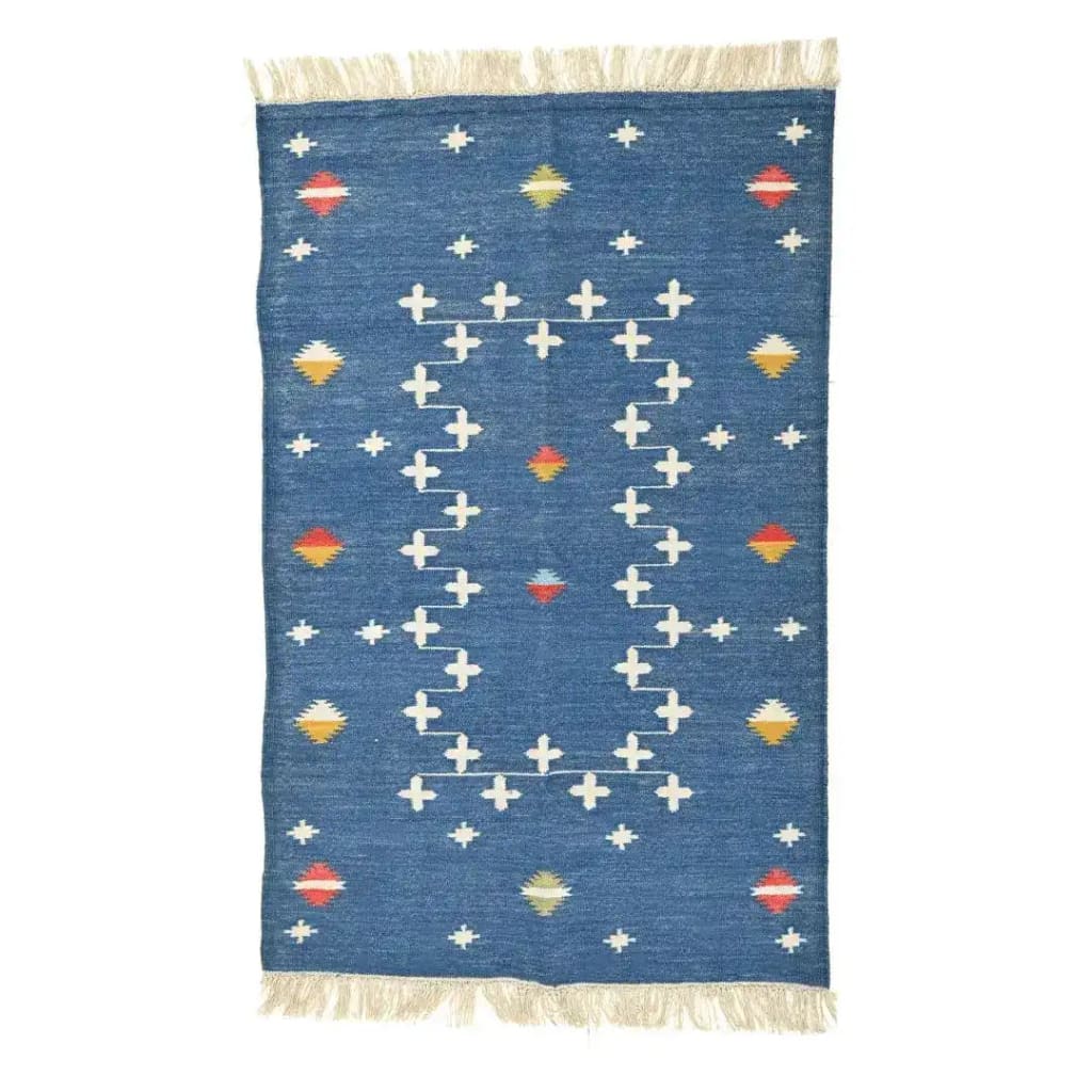 Handwoven dark cobalt blue cotton area rug featuring an intricate boho pattern with vibrant accents and fringes, ideal for enhancing a bedroom or large living room. Perfect for adding a touch of elegance to living room area rugs.