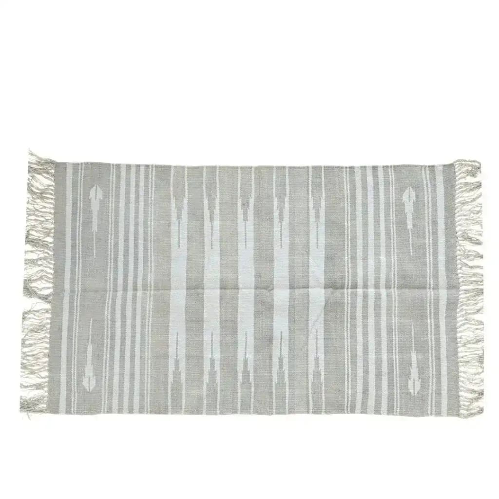 Handwoven gray and white stripe cotton area rug with fringes, perfect as a boho rug for a large living room. This 8x10 living room rug features a simple yet elegant design suitable for modern and cozy spaces.