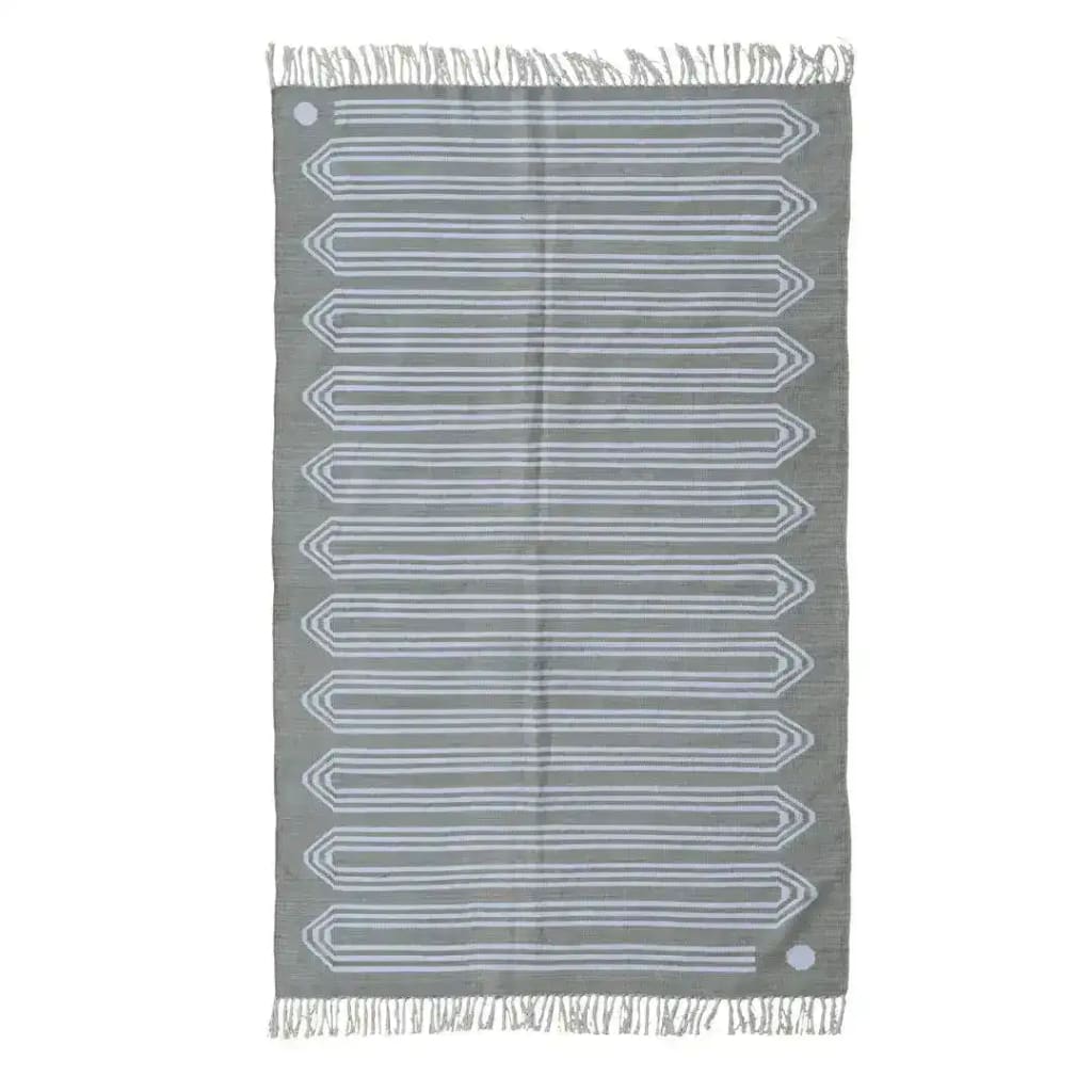 A handwoven gray snake-inspired cotton area rug with fringes, showcasing a unique geometric pattern. Perfect for a boho living room, this large 8x10 rug adds a stylish touch to any space.