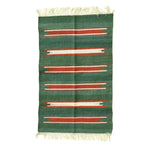 A handwoven green and red striped cotton area rug with fringes, perfect for adding a boho touch to your dining room or living room. This versatile rug enhances formal dining rooms and cozy living spaces with its unique design.