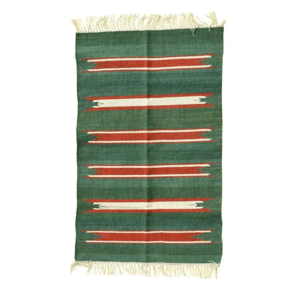 A handwoven green and red striped cotton area rug with fringes, perfect for adding a boho touch to your dining room or living room. This versatile rug enhances formal dining rooms and cozy living spaces with its unique design.
