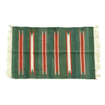 Handwoven green and red stripe cotton area rug with fringes, ideal for adding a boho touch to your living room or dining room. Perfect for formal dining room settings or as a cozy accent in any space.